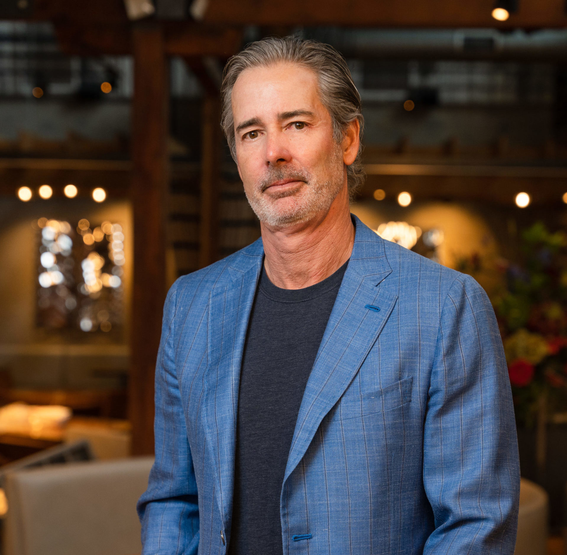 Man in a suit posing in restaurant