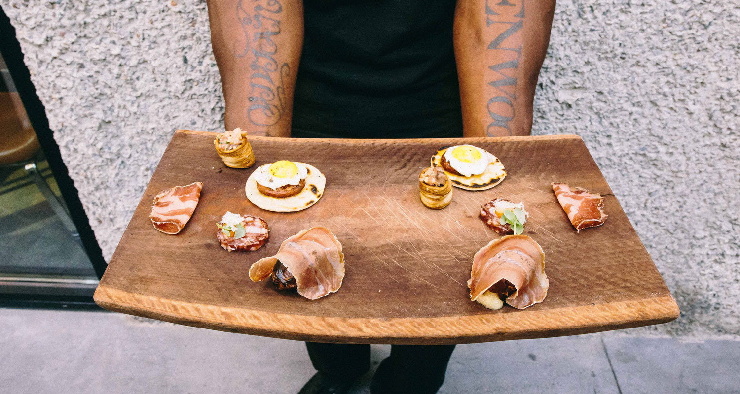 appetizers served on a wooden plate