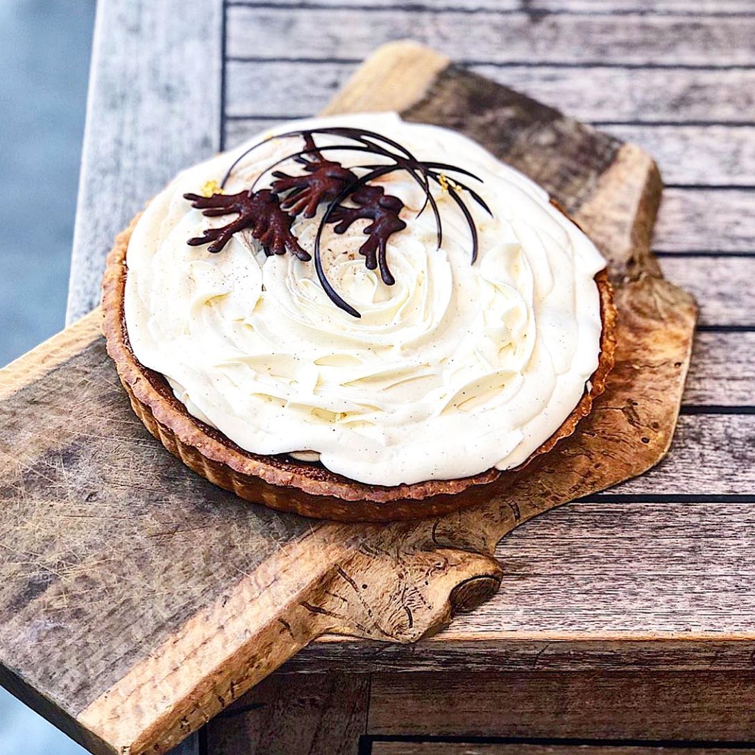 Pie on a plank of wood