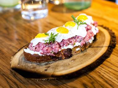 breakfast toast at juniper and ivy served on plank of wood