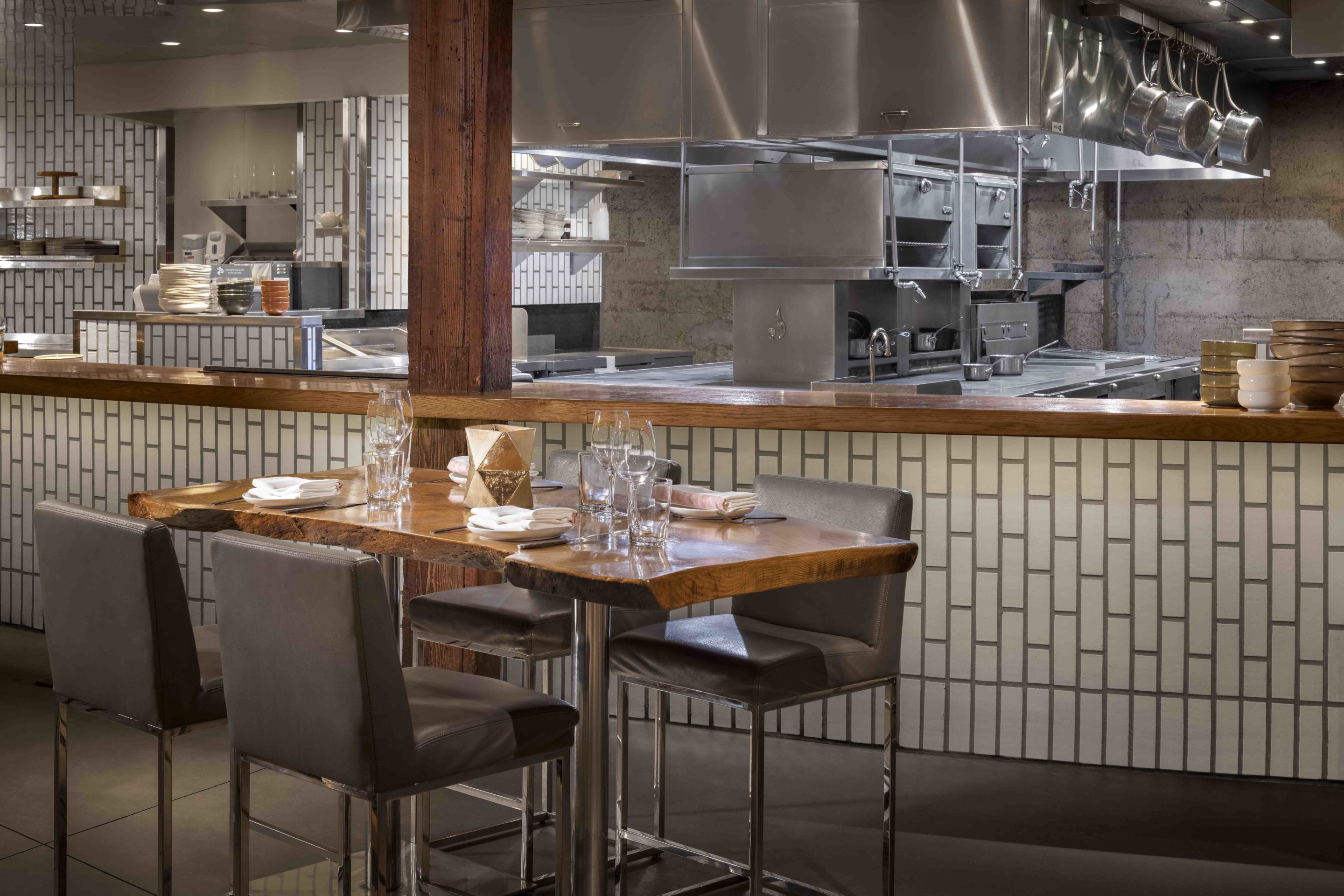 Shot of set table and kitchen behind