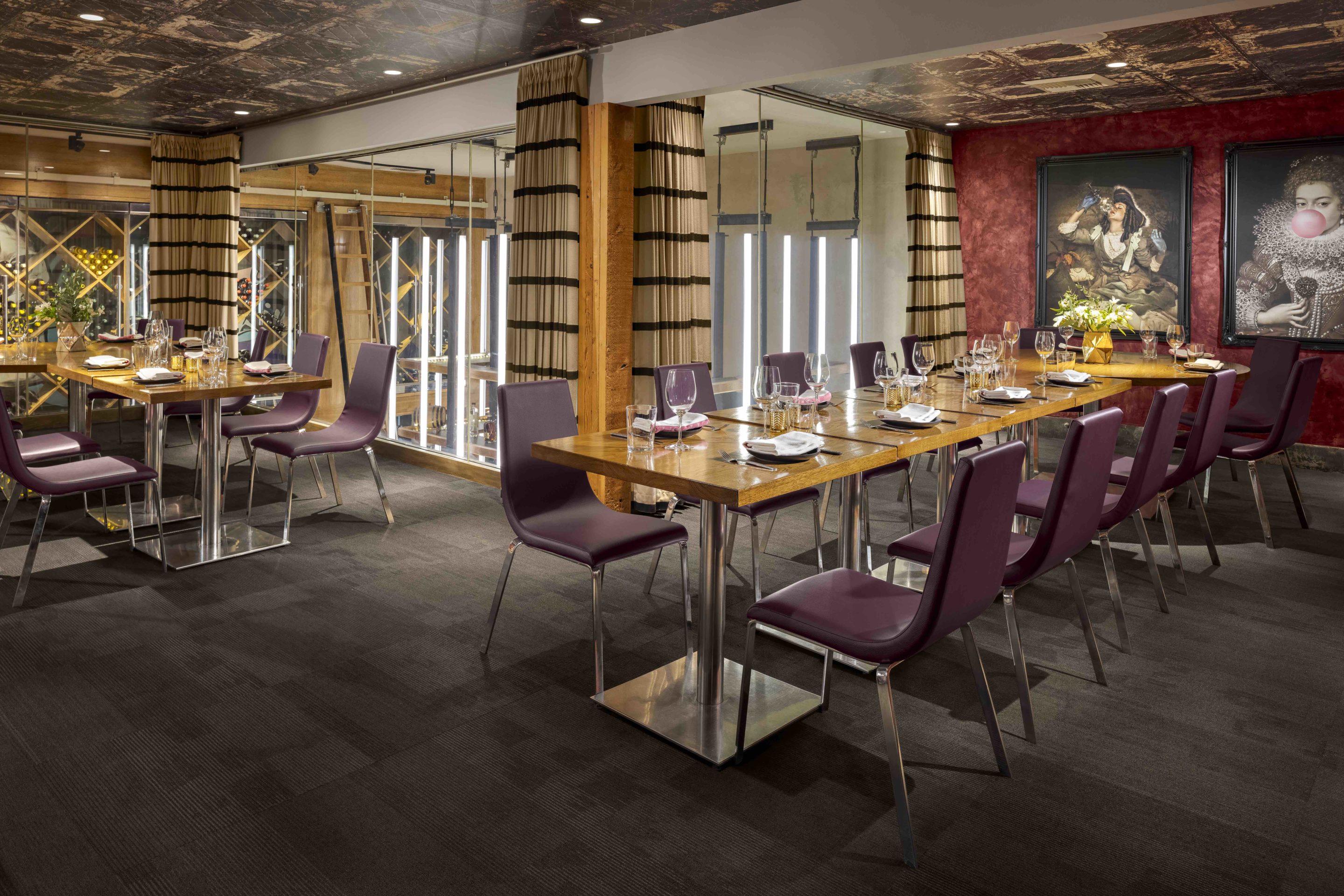 Private dining room with two set tables perpendicular to each other