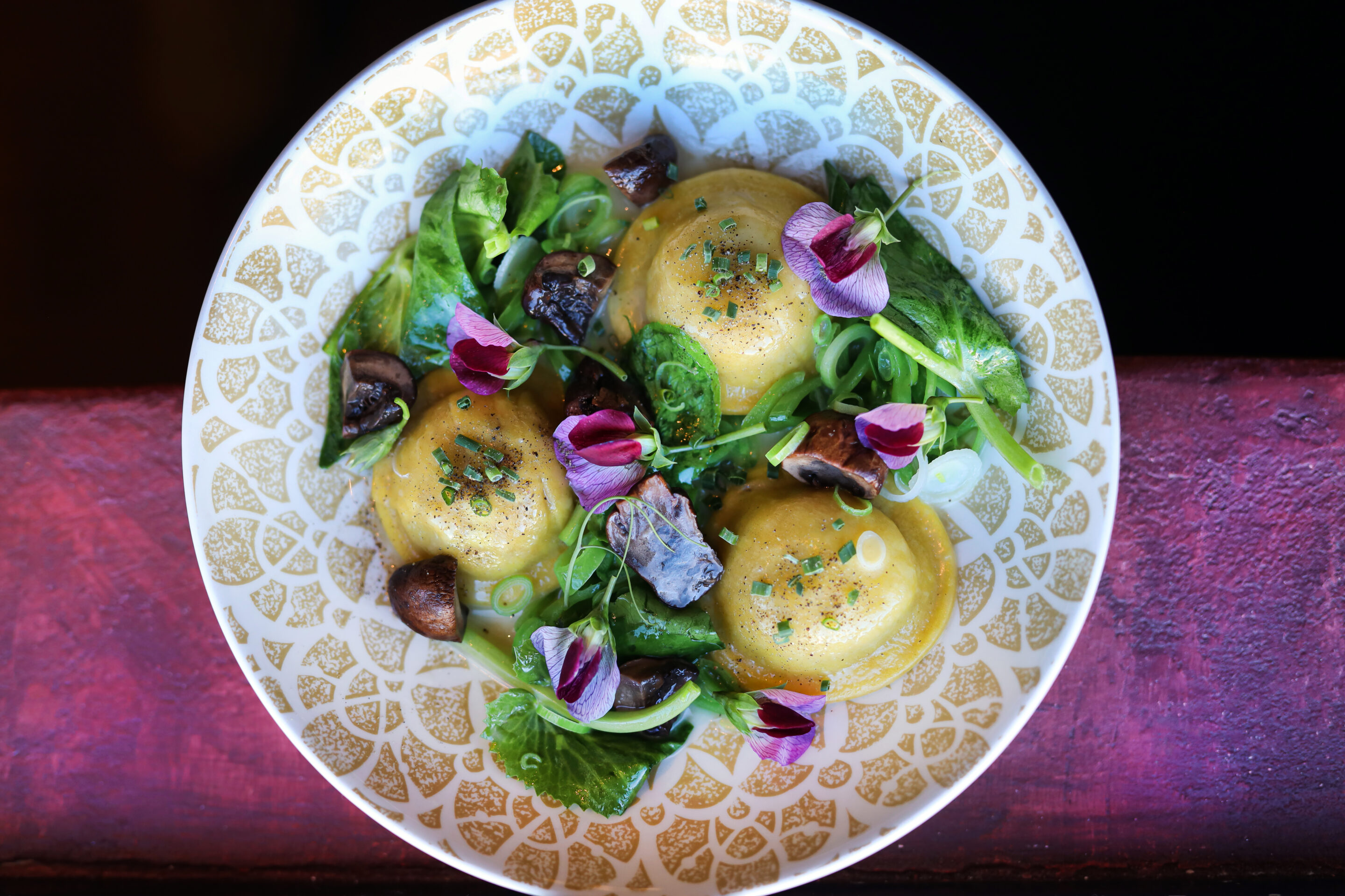 Ravioli with vegetables on plate