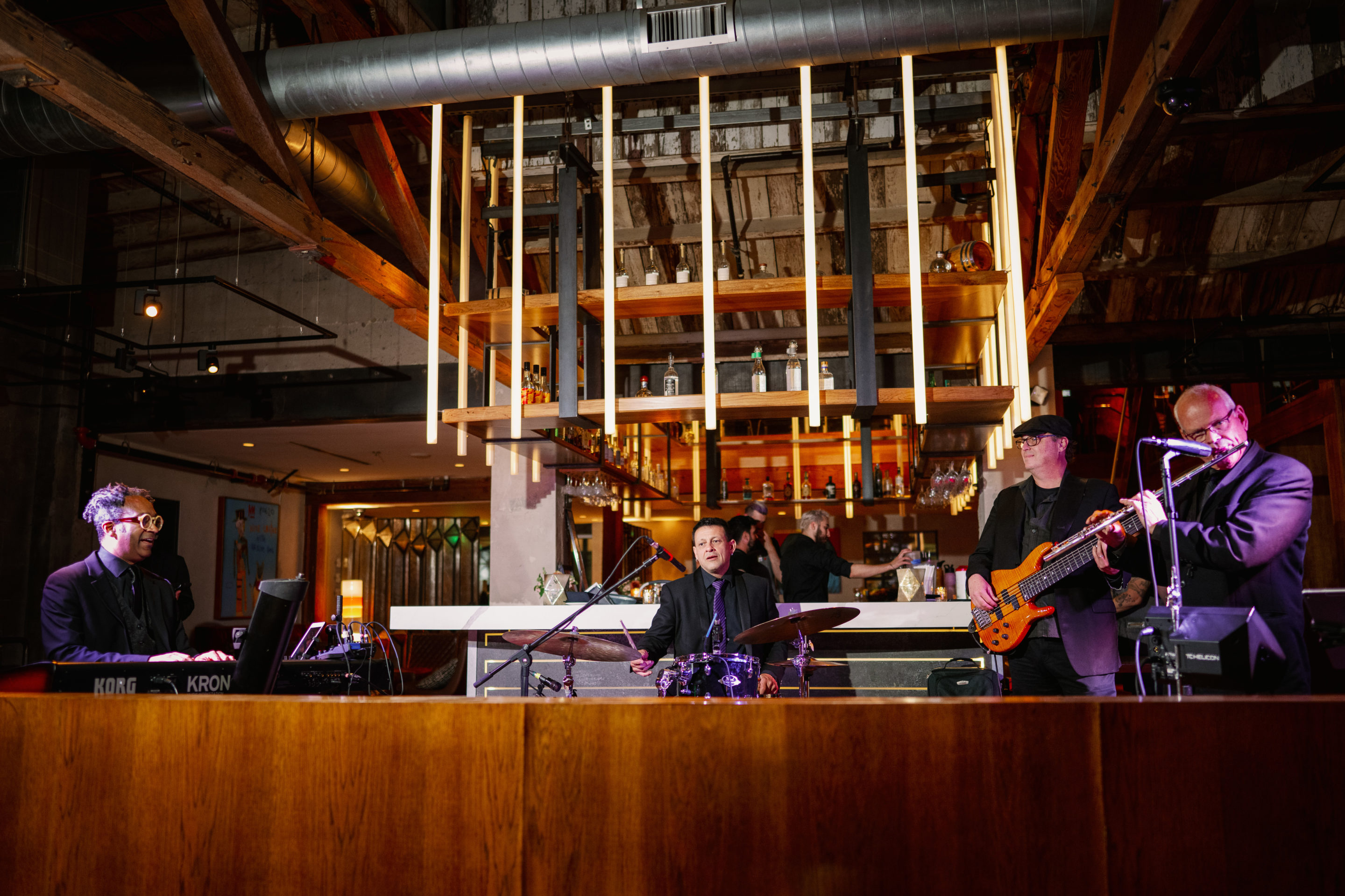 4-piece band playing indoors