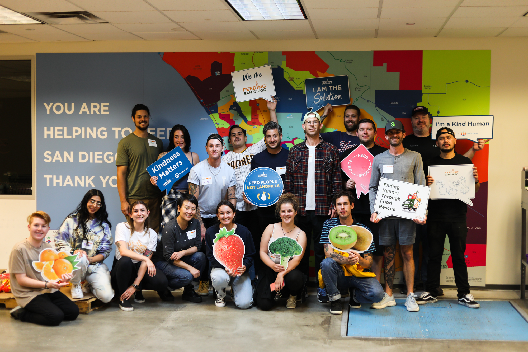 Staff posing in front of Feeding San Diego after volunteering