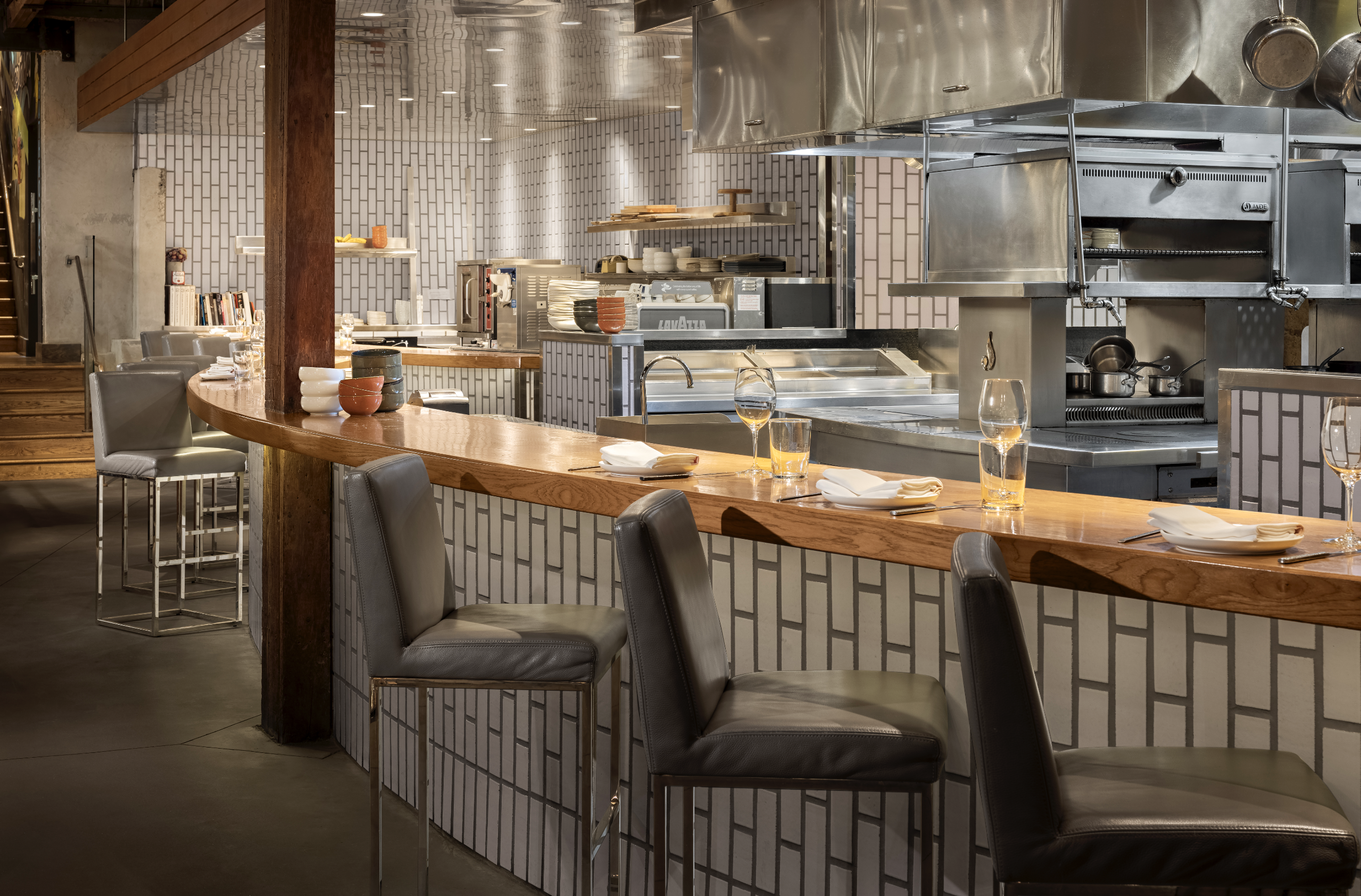 Shot of Chef's counter seats with the kitchen in the background