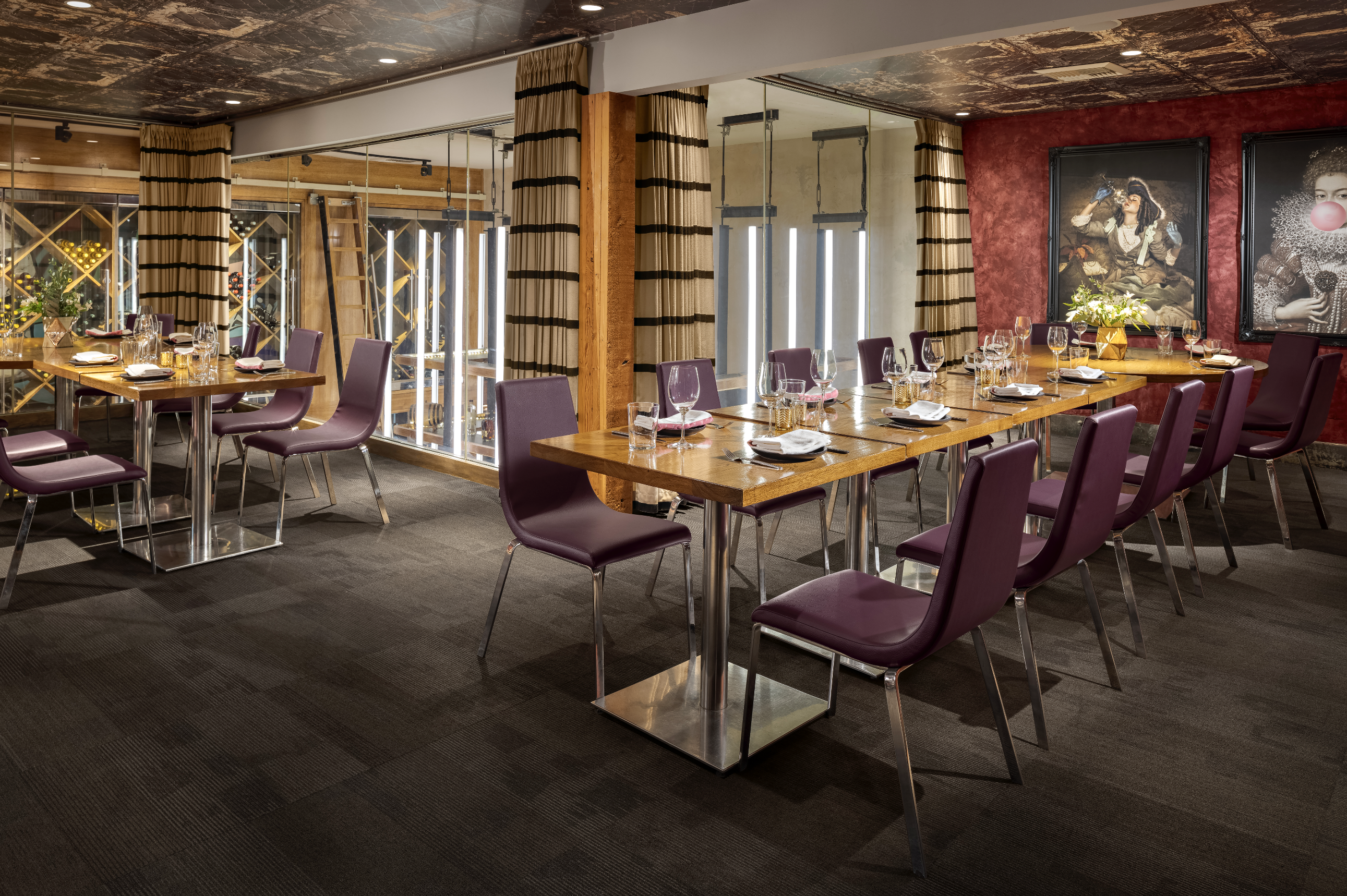 Empty private dining room with two tables perpendicular to each other