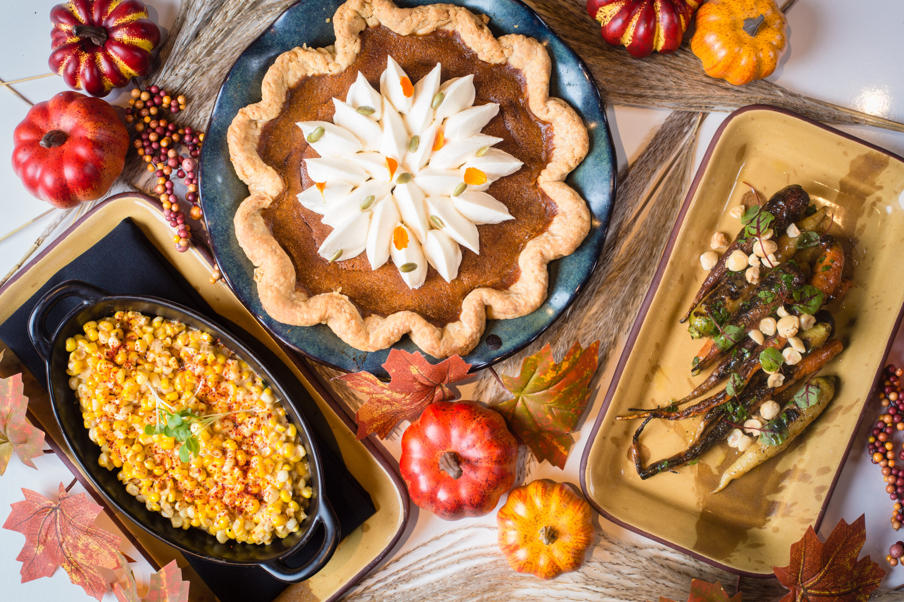 Creamed corn, pumpkin pie, and roasted carrots.