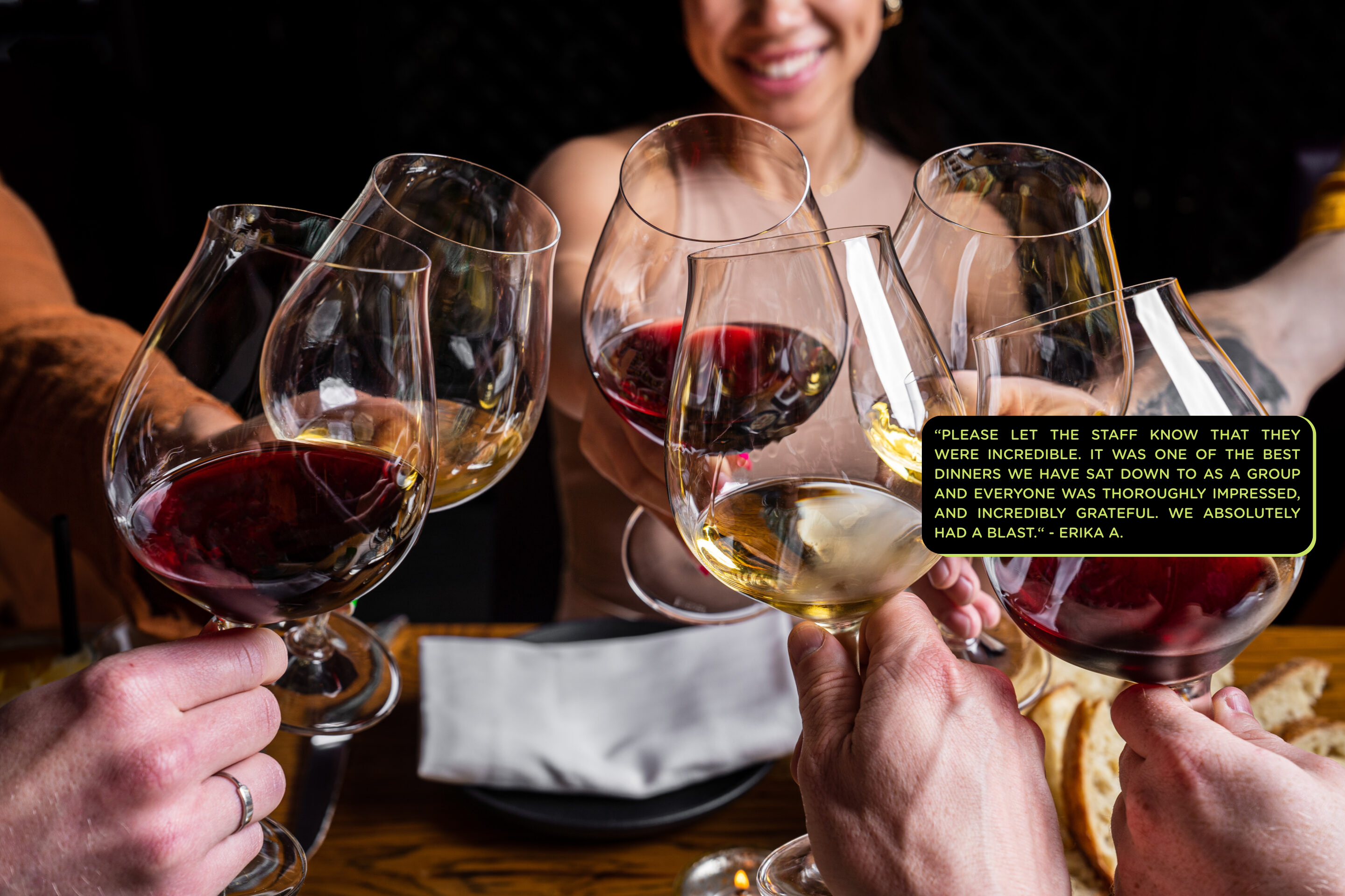 Wine glasses cheersing with text overlay.