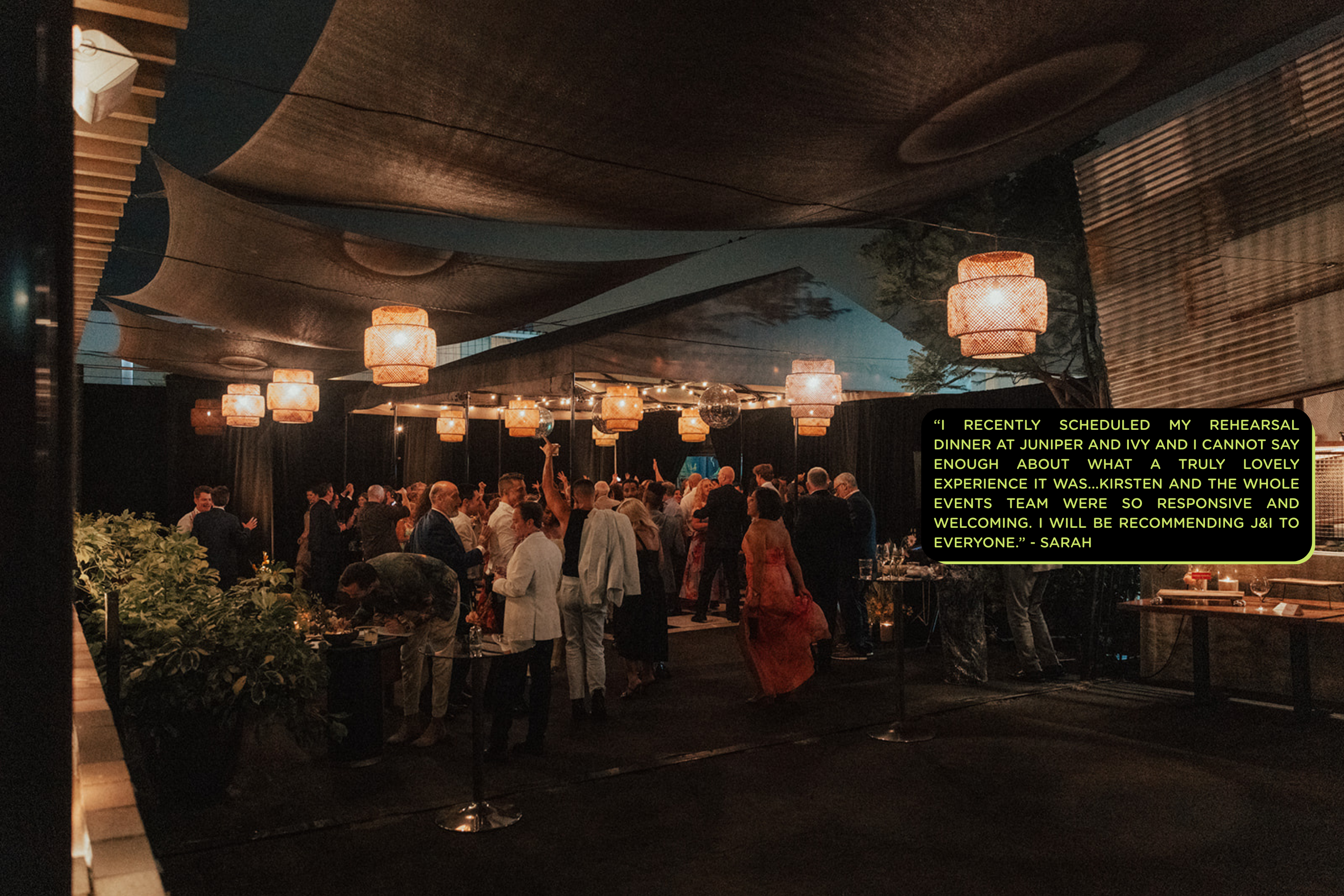 A group of people in an outdoor decorated venue with text overlay.